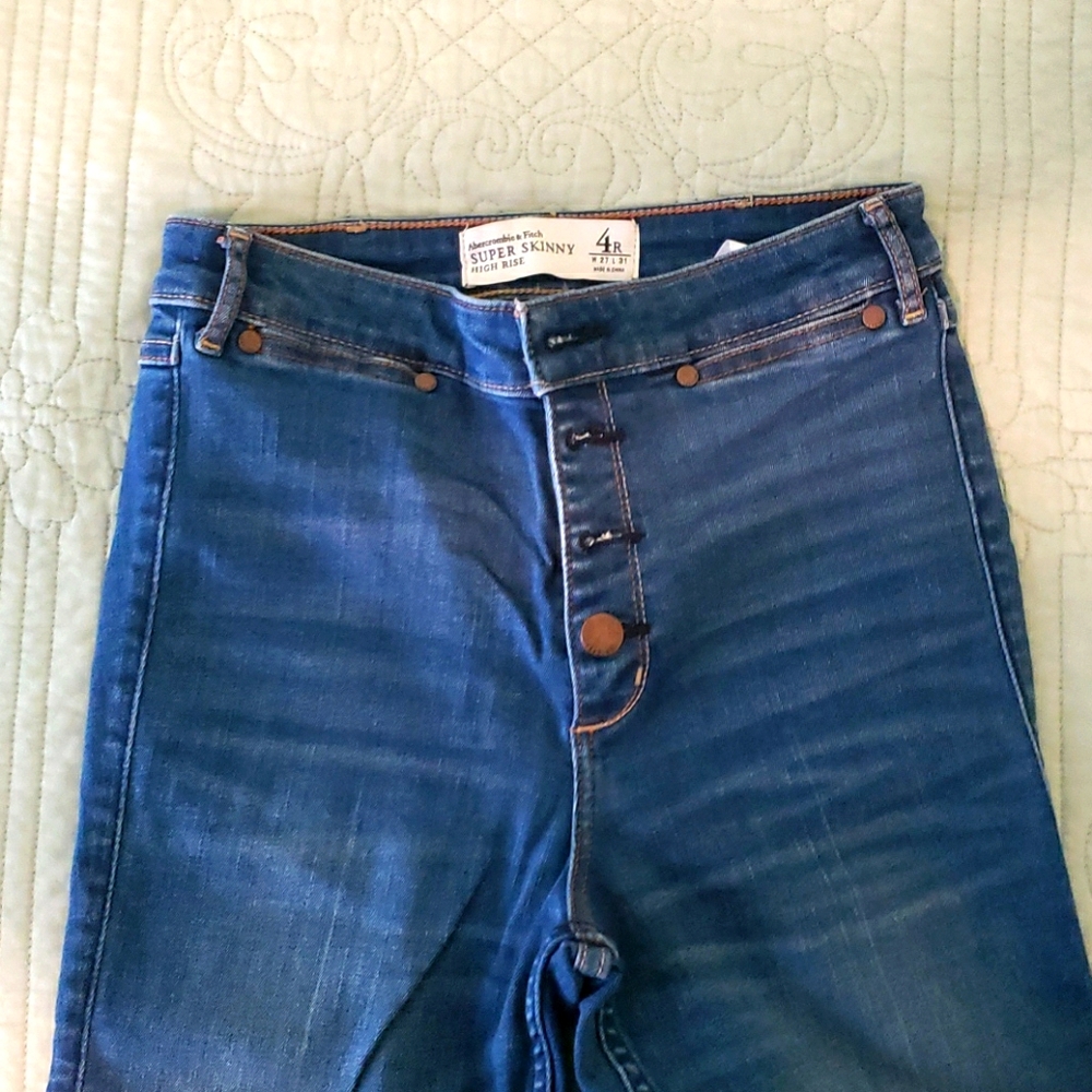 Medium wash button up high rise super skinny jeans